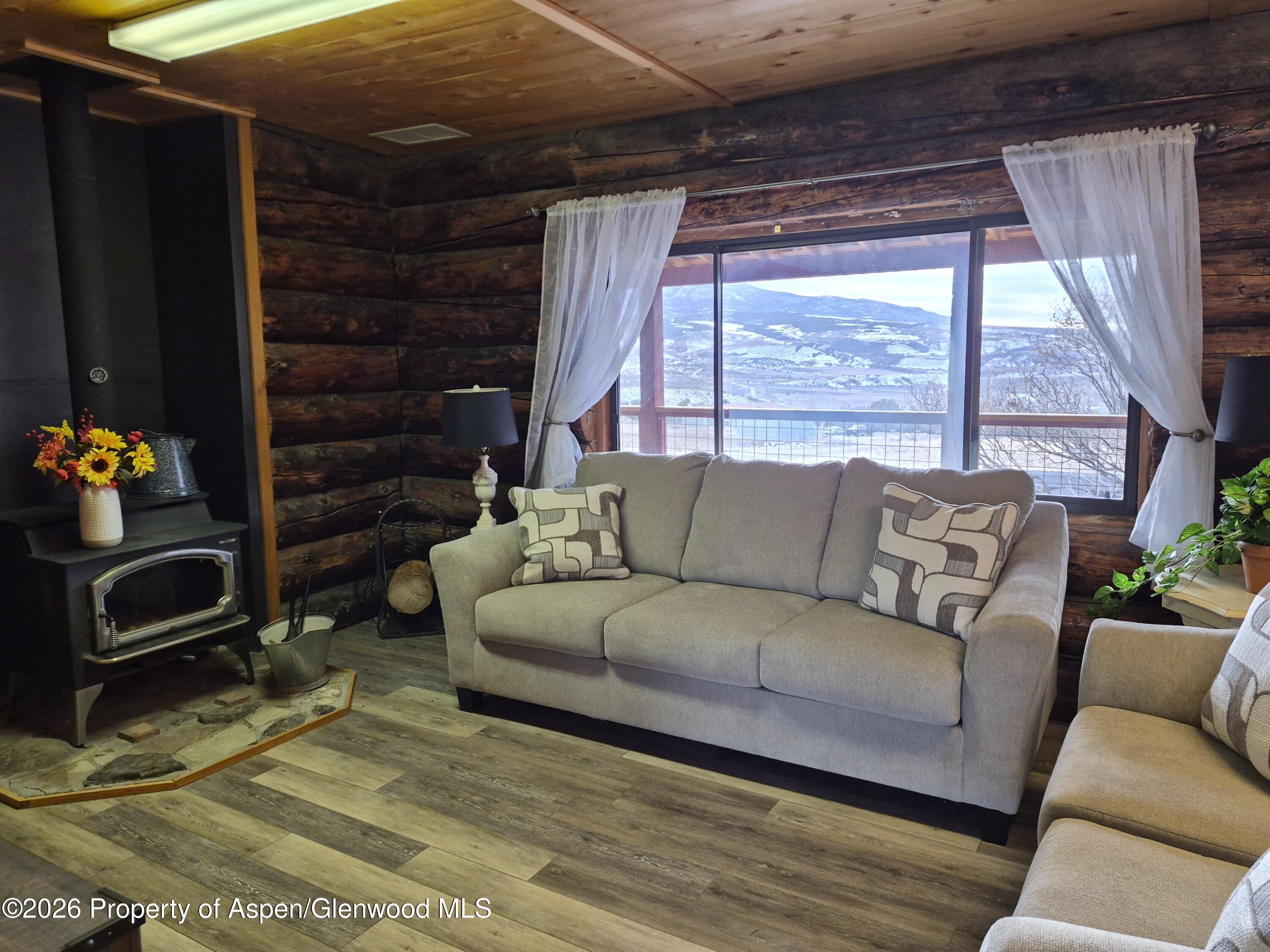 6194 County Road 320 Rifle, CO 81650 - Photo 21 of 54 a living room with furniture and a window