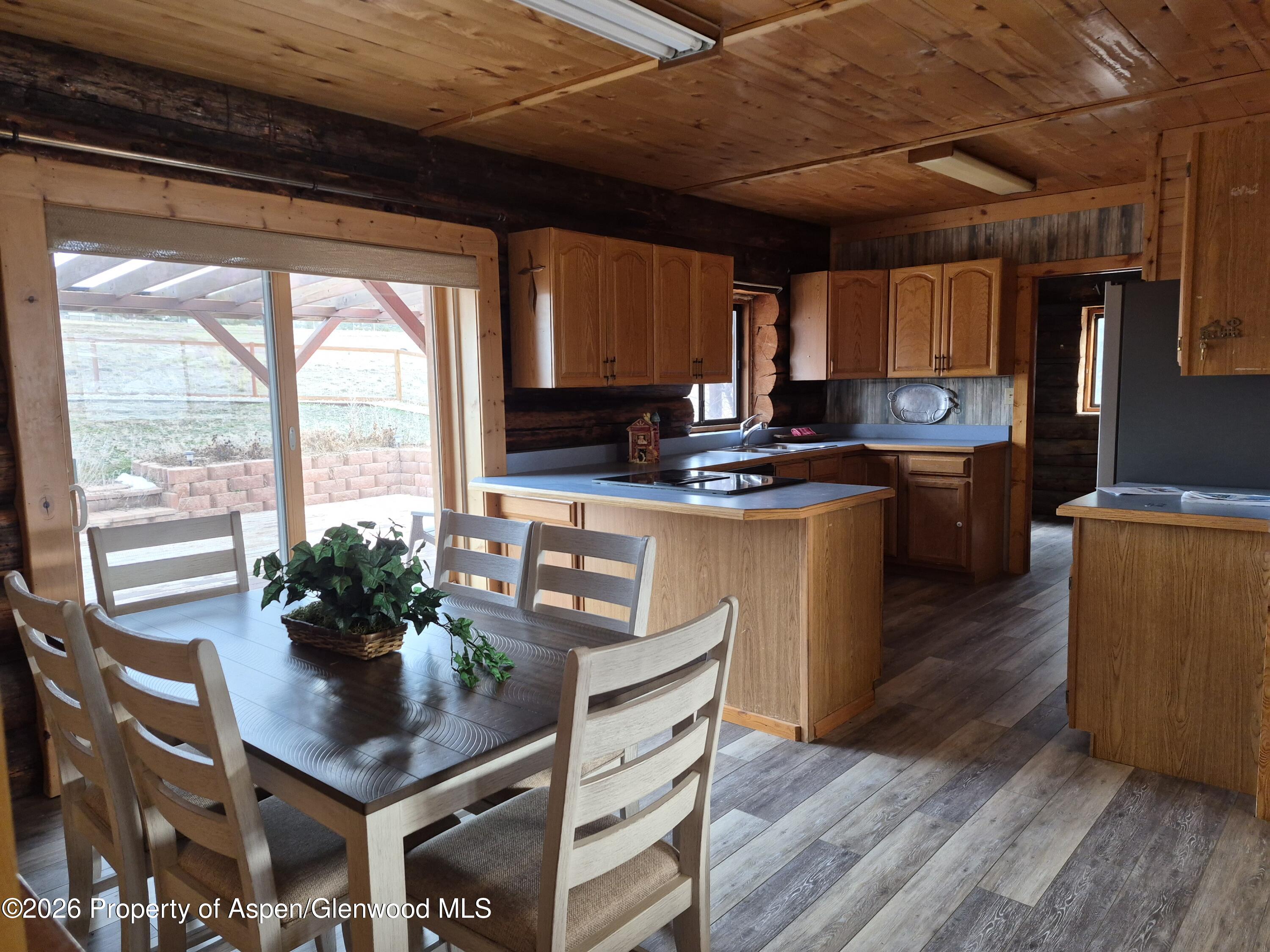 6194 County Road 320 Rifle, CO 81650 - Photo 25 of 54 a kitchen with a table chairs and wooden floor