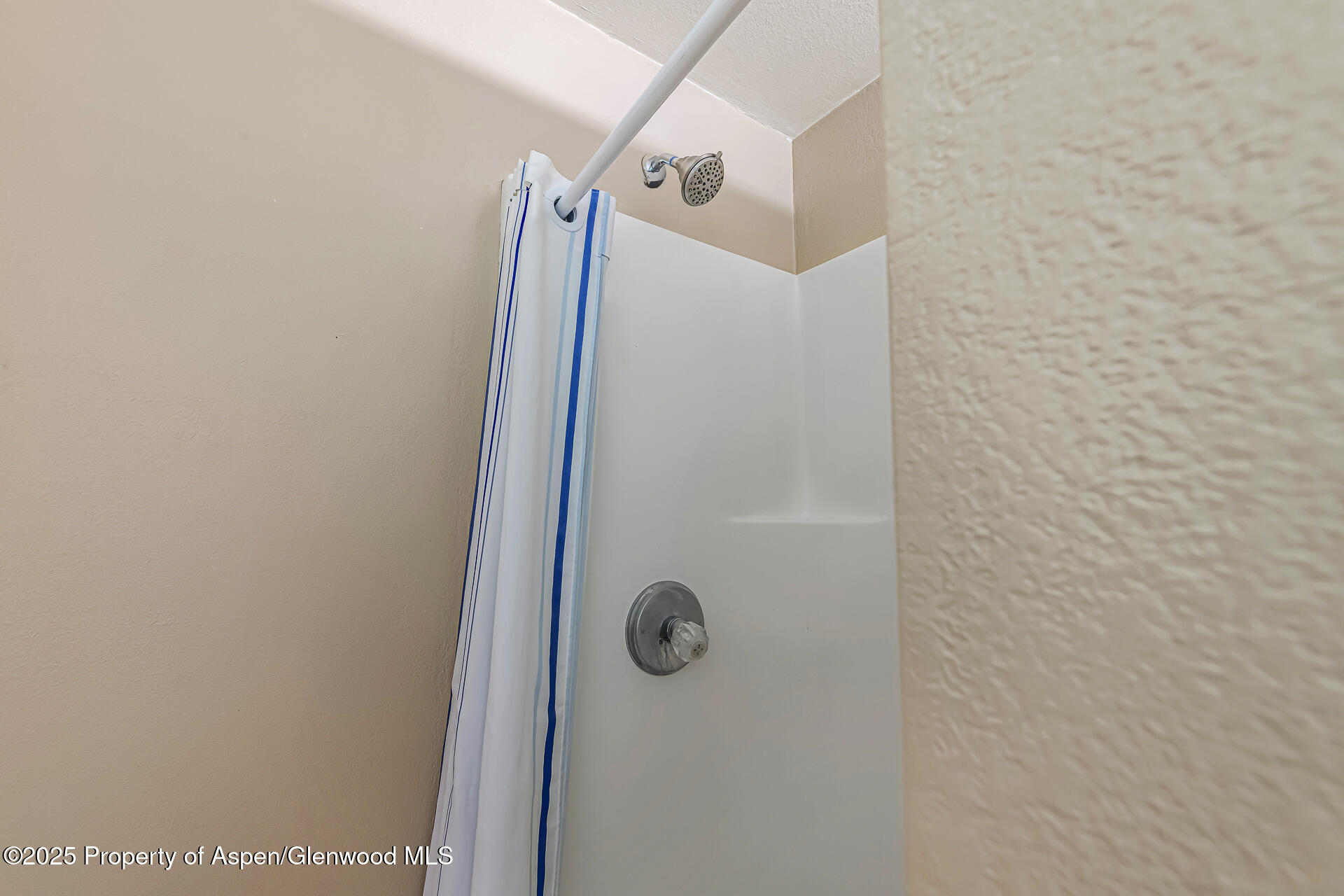 6194 County Road 320 Rifle, CO 81650 - Photo 40 of 54 a bathroom with a glass shower door