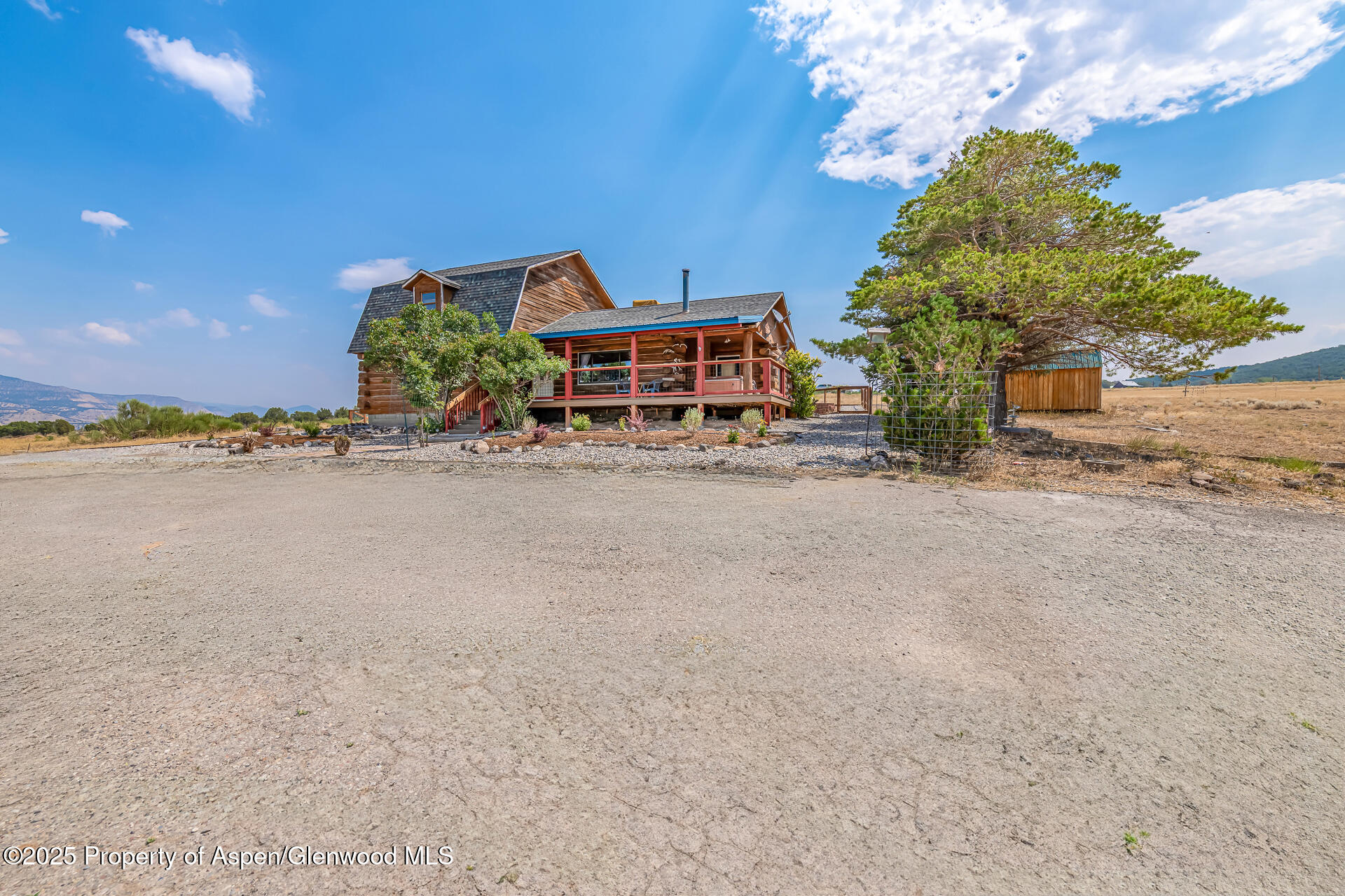 6194 County Road 320 Rifle, CO 81650 - Photo 52 of 54 a front view of a house with lake view and a parking space