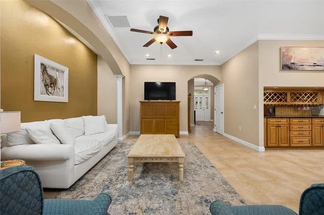 a kitchen with a sink stove and chairs