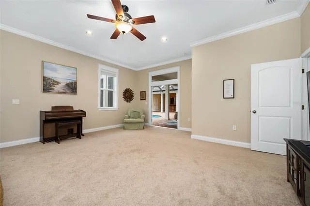 a bedroom with a bed dresser and wooden floor