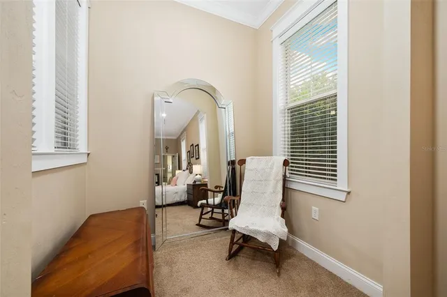 a spacious bedroom with a bed and a table