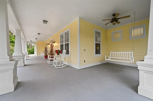 a view of a livingroom with furniture and a ceiling fan