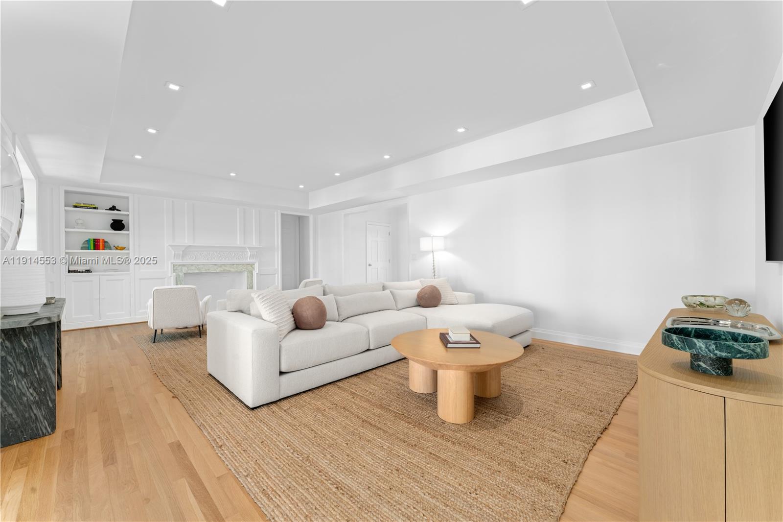 6675 Roxbury Lane Miami Beach, FL 33141 - Photo 19 of 40 a living room with furniture and a table