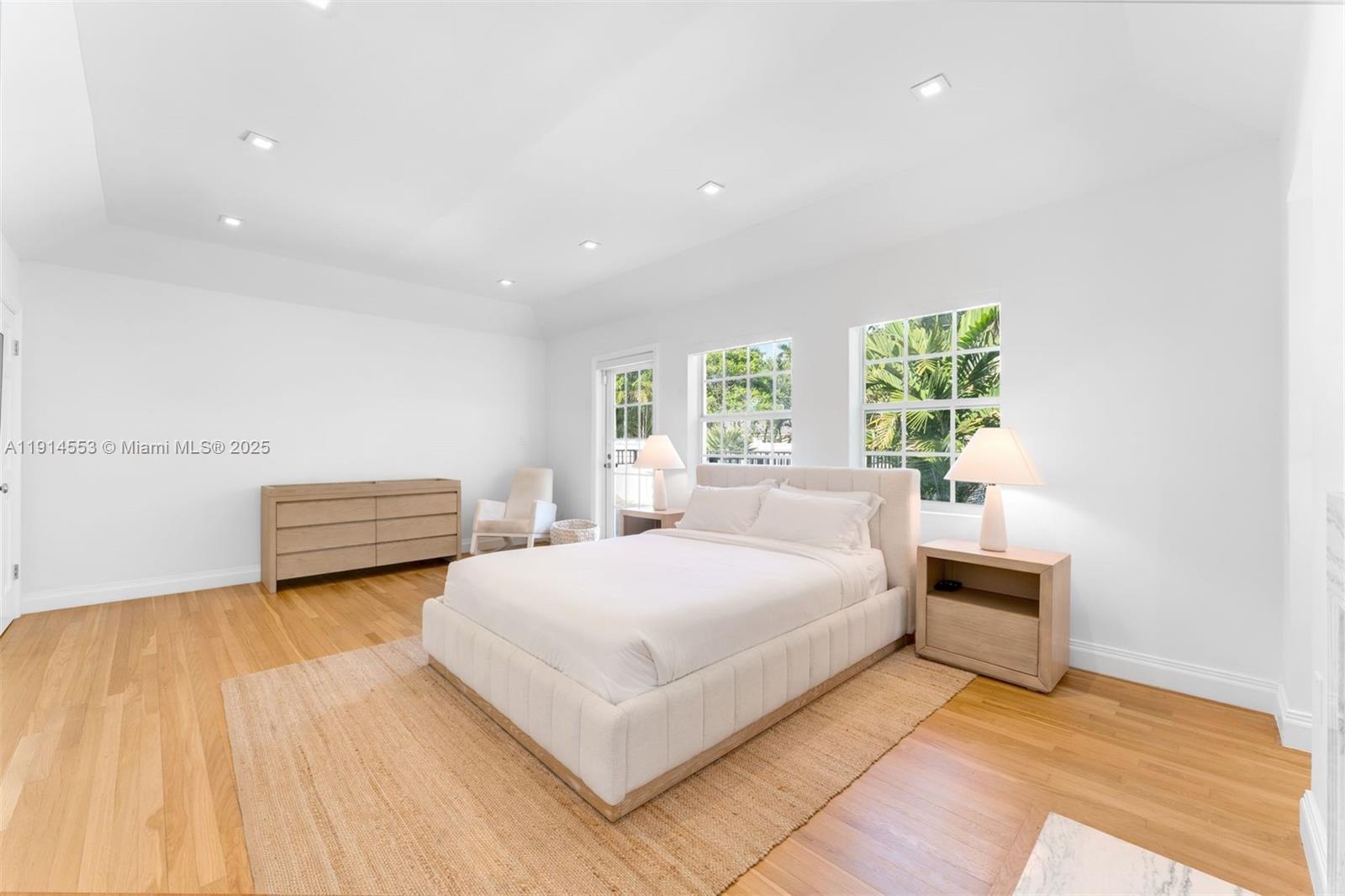 6675 Roxbury Lane Miami Beach, FL 33141 - Photo 20 of 40 a bedroom with a bed and a large window