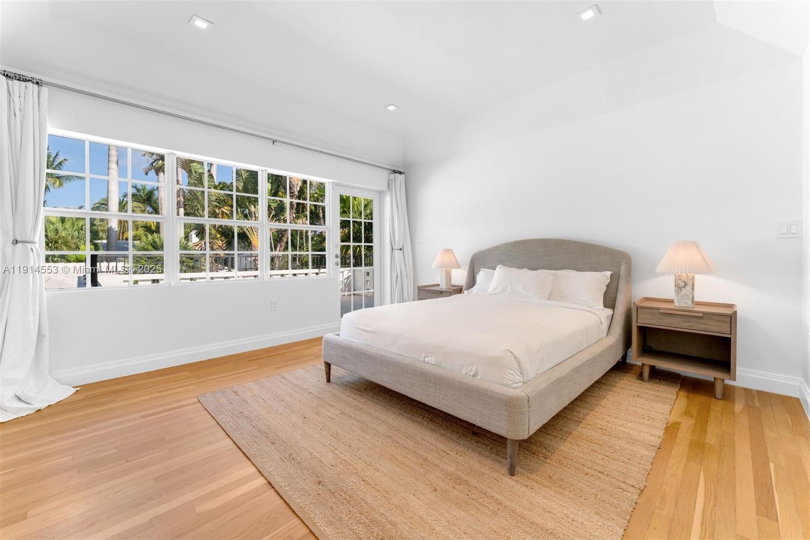 6675 Roxbury Lane Miami Beach, FL 33141 - Photo 24 of 40 a bedroom with a bed and wooden floor