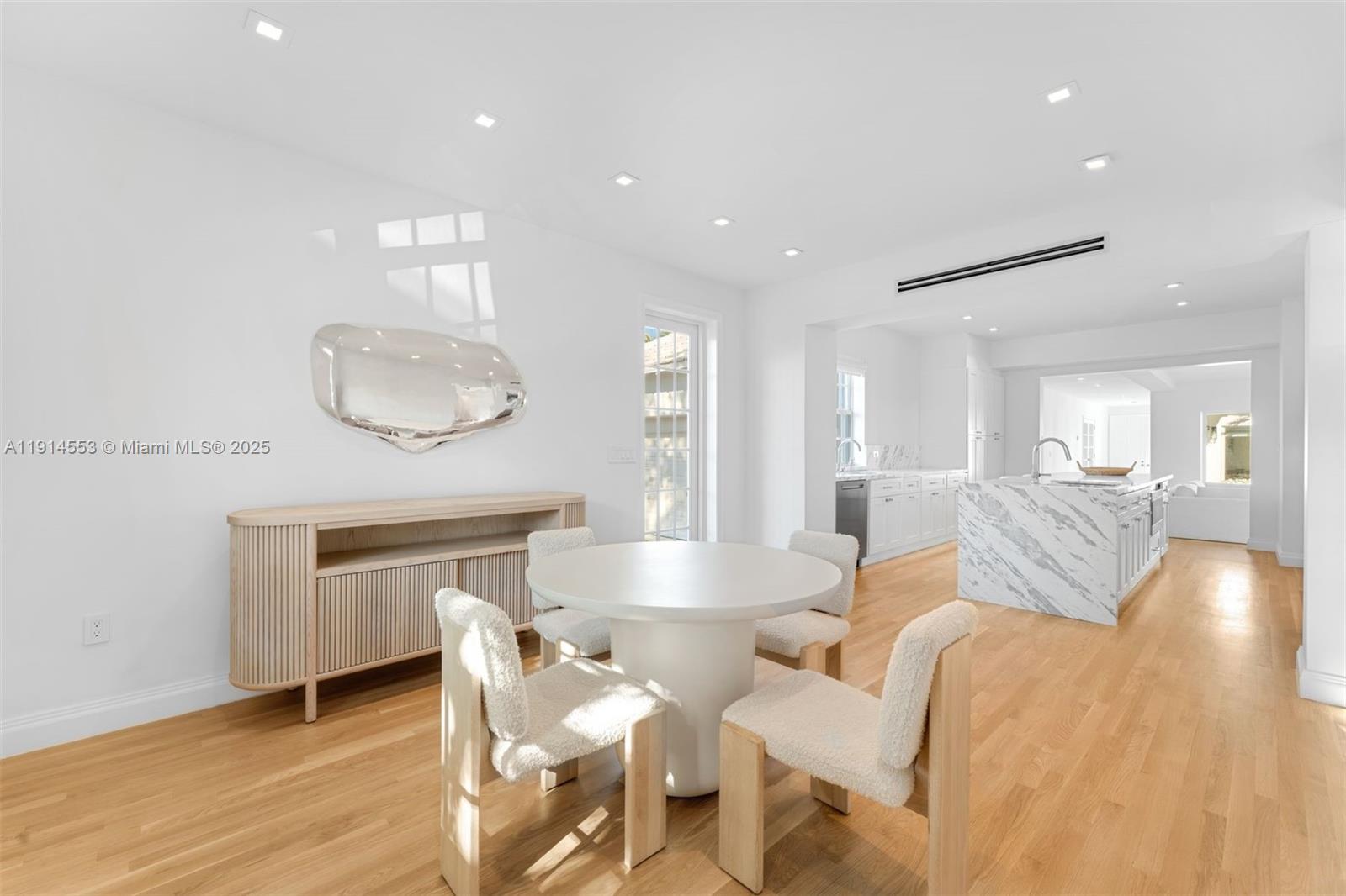 6675 Roxbury Lane Miami Beach, FL 33141 - Photo 33 of 40 a living room with furniture a fireplace and wooden floor