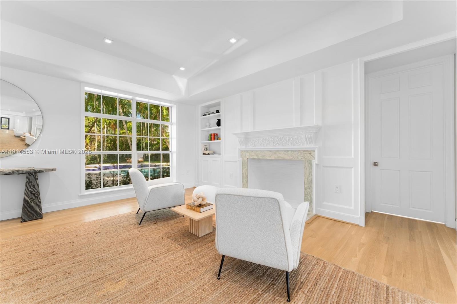 6675 Roxbury Lane Miami Beach, FL 33141 - Photo 39 of 40 a living room with furniture and a large window