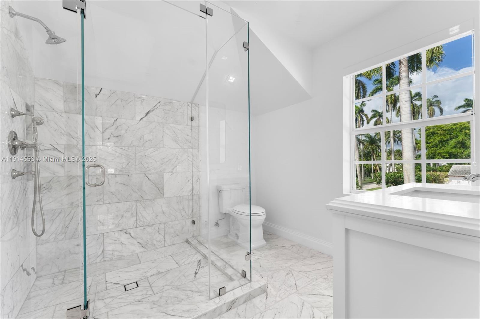6675 Roxbury Lane Miami Beach, FL 33141 - Photo 6 of 40 a bathroom with a shower and a sink
