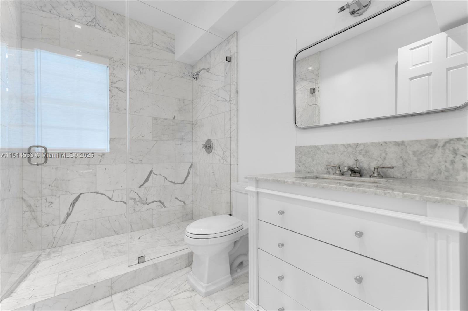 6675 Roxbury Lane Miami Beach, FL 33141 - Photo 8 of 40 a bathroom with a sink toilet and shower