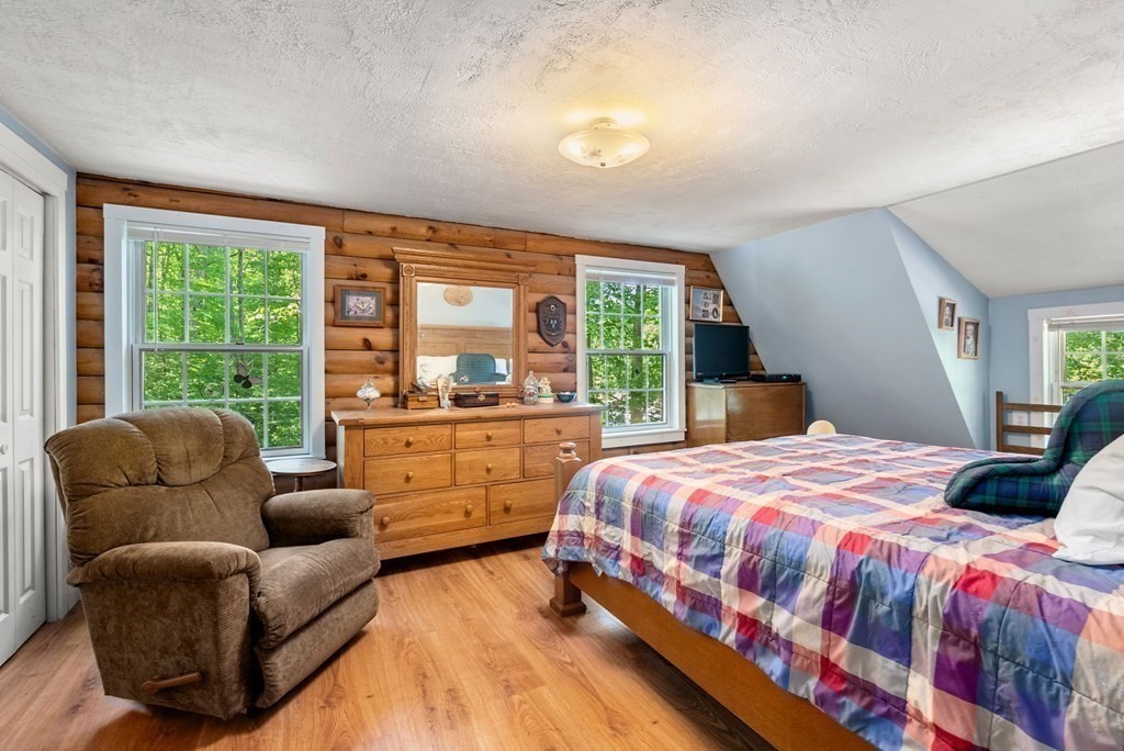 73 Allen Road Brookfield, MA 01506 - Photo 27 of 39 a bedroom with a bed and large windows