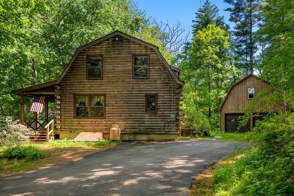 73 Allen Road Brookfield, MA 01506 - Photo 9 of 39 a front view of a house with a yard and garage