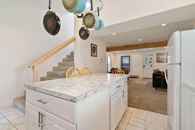 a view of a black door and a window