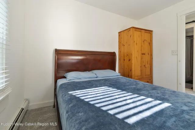 a bathroom with a sink vanity mirror and toilet