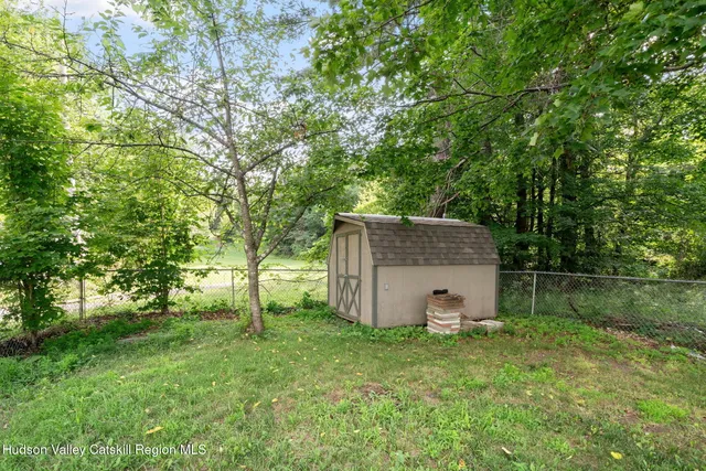 a front view of house with yard and outdoor seating