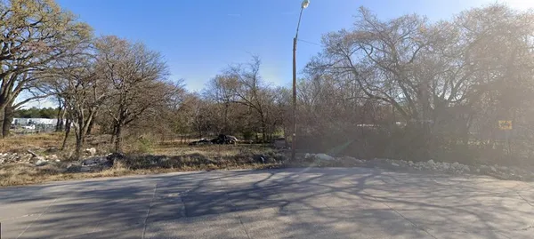 a view of a backyard of the house