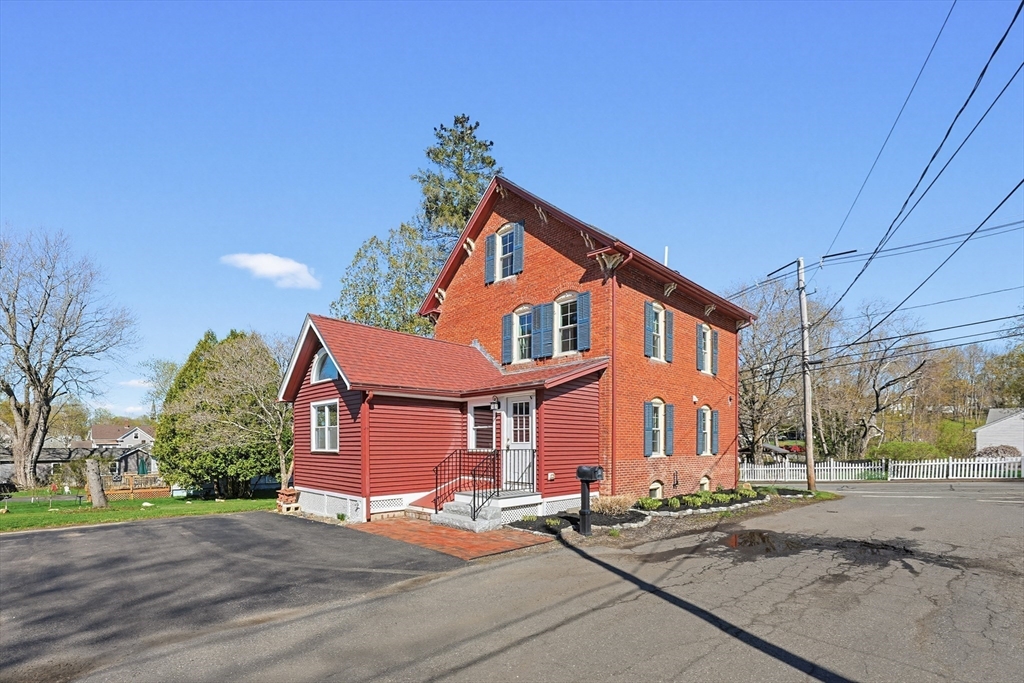 44 Clark Street Spencer, MA 01562 - Photo 3 of 41 a front view of a house with a yard