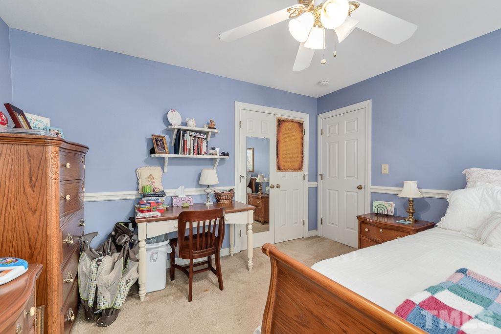 2416 Basil Drive Raleigh, NC 27612 - Photo 22 of 26 a view of a dining room with furniture and chandelier