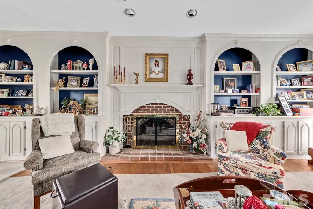 2416 Basil Drive Raleigh, NC 27612 - Photo 6 of 26 a living room with fireplace furniture and a fireplace