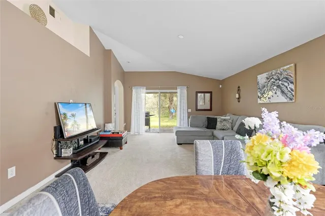 a bedroom with bed and a flat screen tv