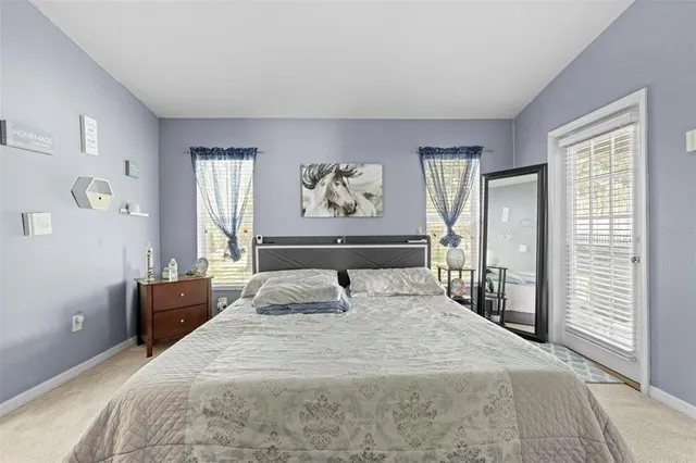 a bathroom with a granite countertop sink and a bathtub