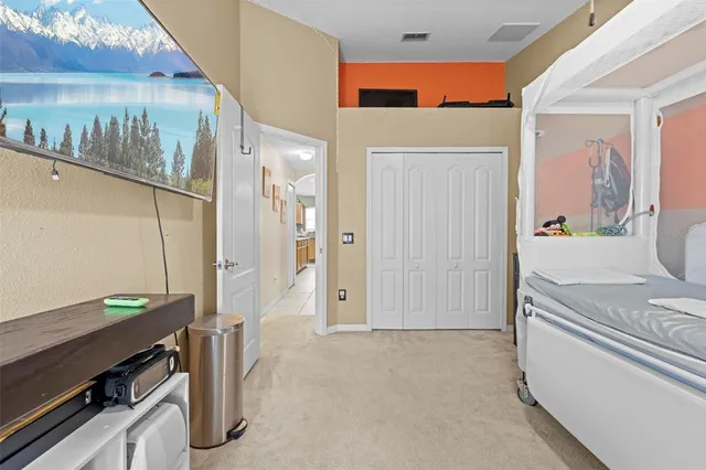 a bathroom with a sink vanity mirror and toilet