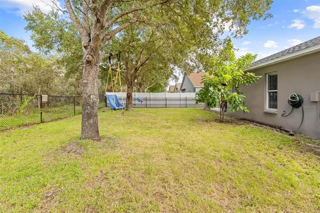 a view of kitchen with table and chairs