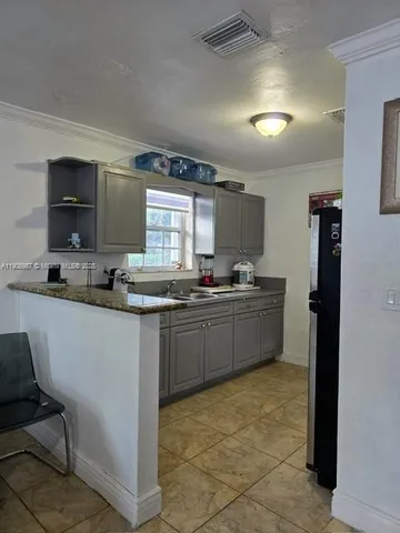 a bathroom with a toilet a sink and shower