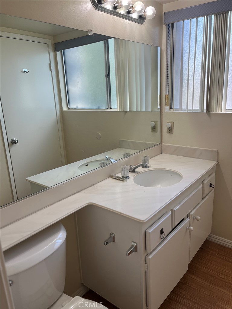 19547 Rinaldi Street, Unit 27 Porter Ranch, CA 91326 - Photo 15 of 20 a bathroom with a sink and a mirror