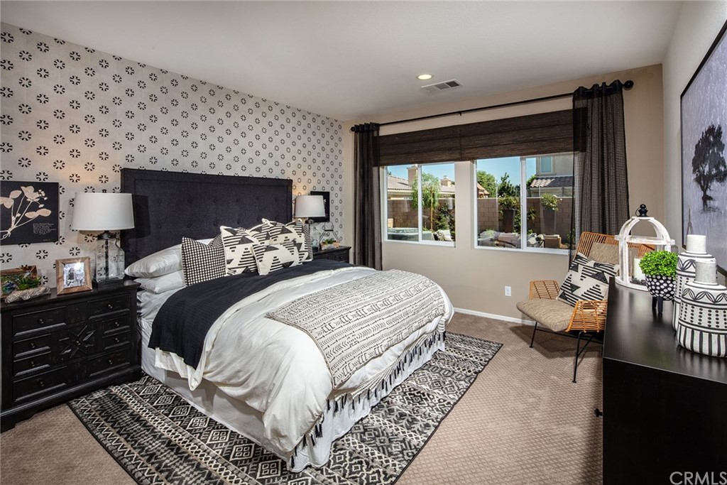 44402 Beringer Drive Indio, CA 92203 - Photo 11 of 18 a bedroom with a bed and wooden floor