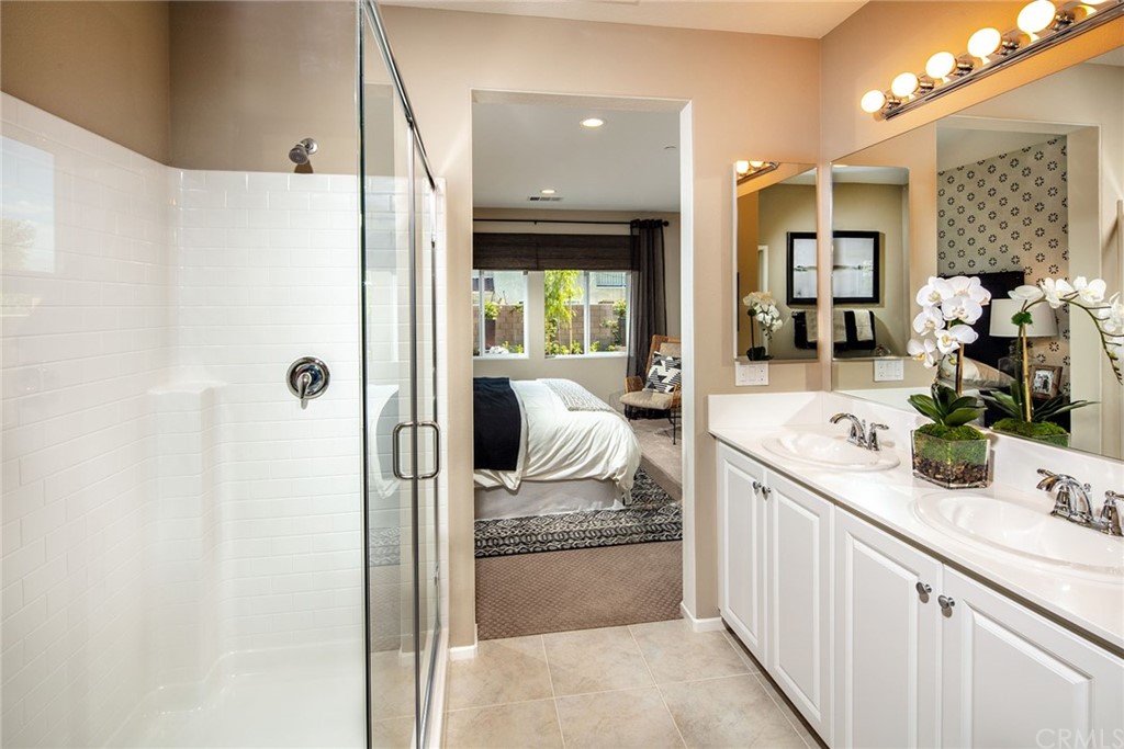 44402 Beringer Drive Indio, CA 92203 - Photo 13 of 18 a bathroom with a tub sink and mirror