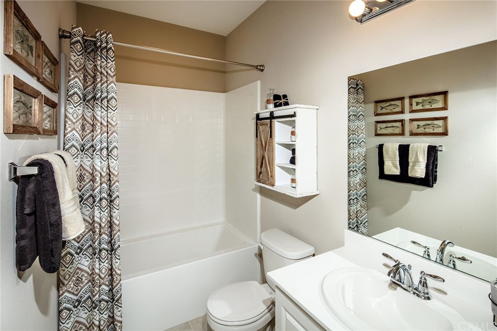 44402 Beringer Drive Indio, CA 92203 - Photo 16 of 18 a bathroom with a sink toilet and shower