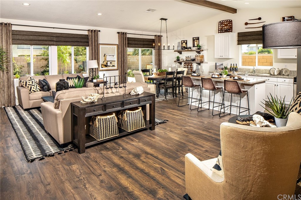 44402 Beringer Drive Indio, CA 92203 - Photo 3 of 18 a living room with furniture large window and wooden floor