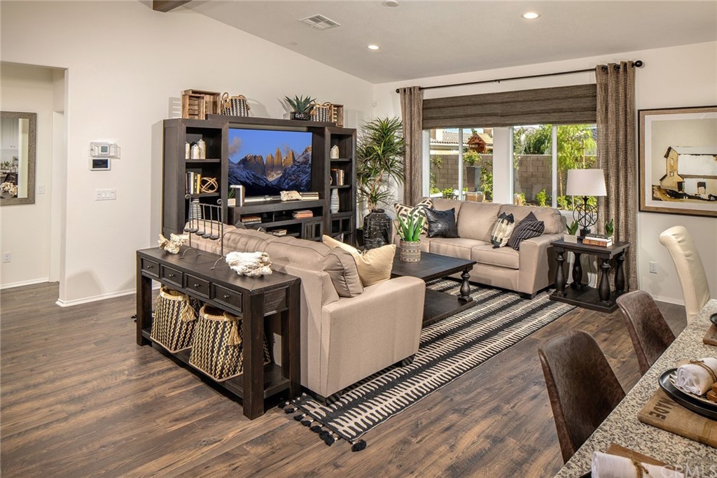 44402 Beringer Drive Indio, CA 92203 - Photo 4 of 18 a living room with furniture a flat screen tv and a large window