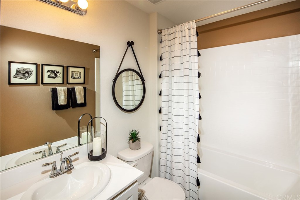 44402 Beringer Drive Indio, CA 92203 - Photo 9 of 18 a bathroom with a sink and a mirror