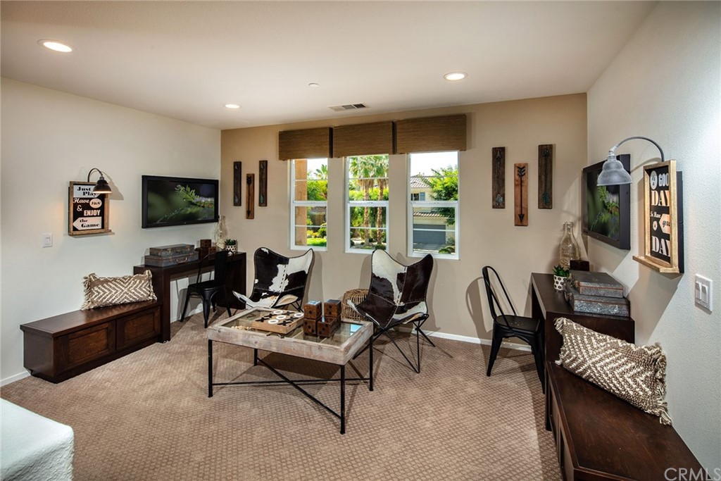 44402 Beringer Drive Indio, CA 92203 - Photo 10 of 18 a living room with furniture and a flat screen tv