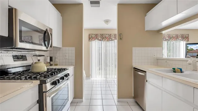a kitchen with a stove and a sink
