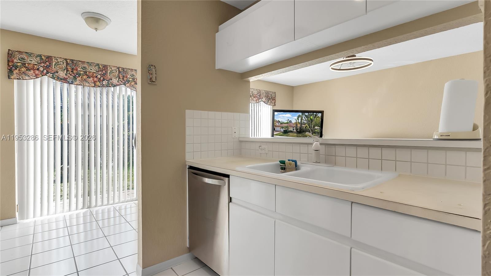 15486 Southwest 147th Street Miami, FL 33196 - Photo 12 of 30 a bathroom with a sink and a mirror