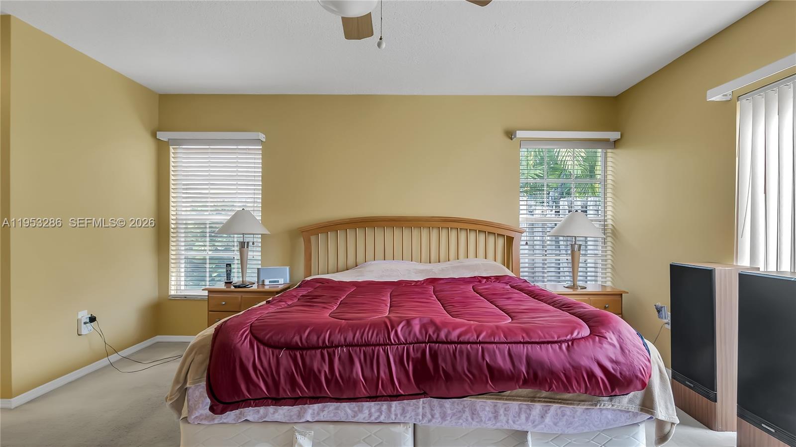 15486 Southwest 147th Street Miami, FL 33196 - Photo 16 of 30 a bedroom with a bed and a window