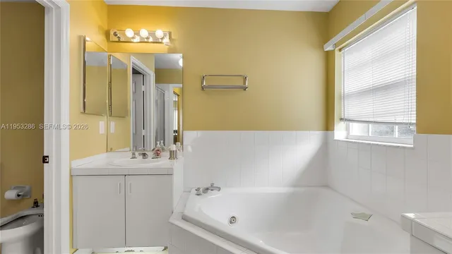 a bathroom with a bathtub and shower