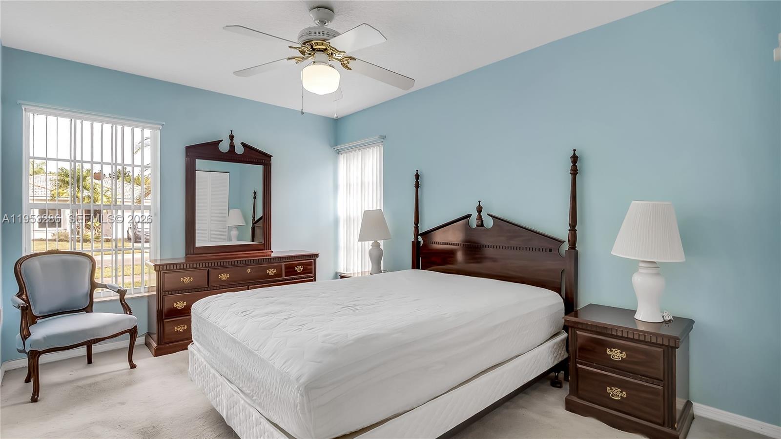 15486 Southwest 147th Street Miami, FL 33196 - Photo 20 of 30 a bedroom with a bed and wooden floor