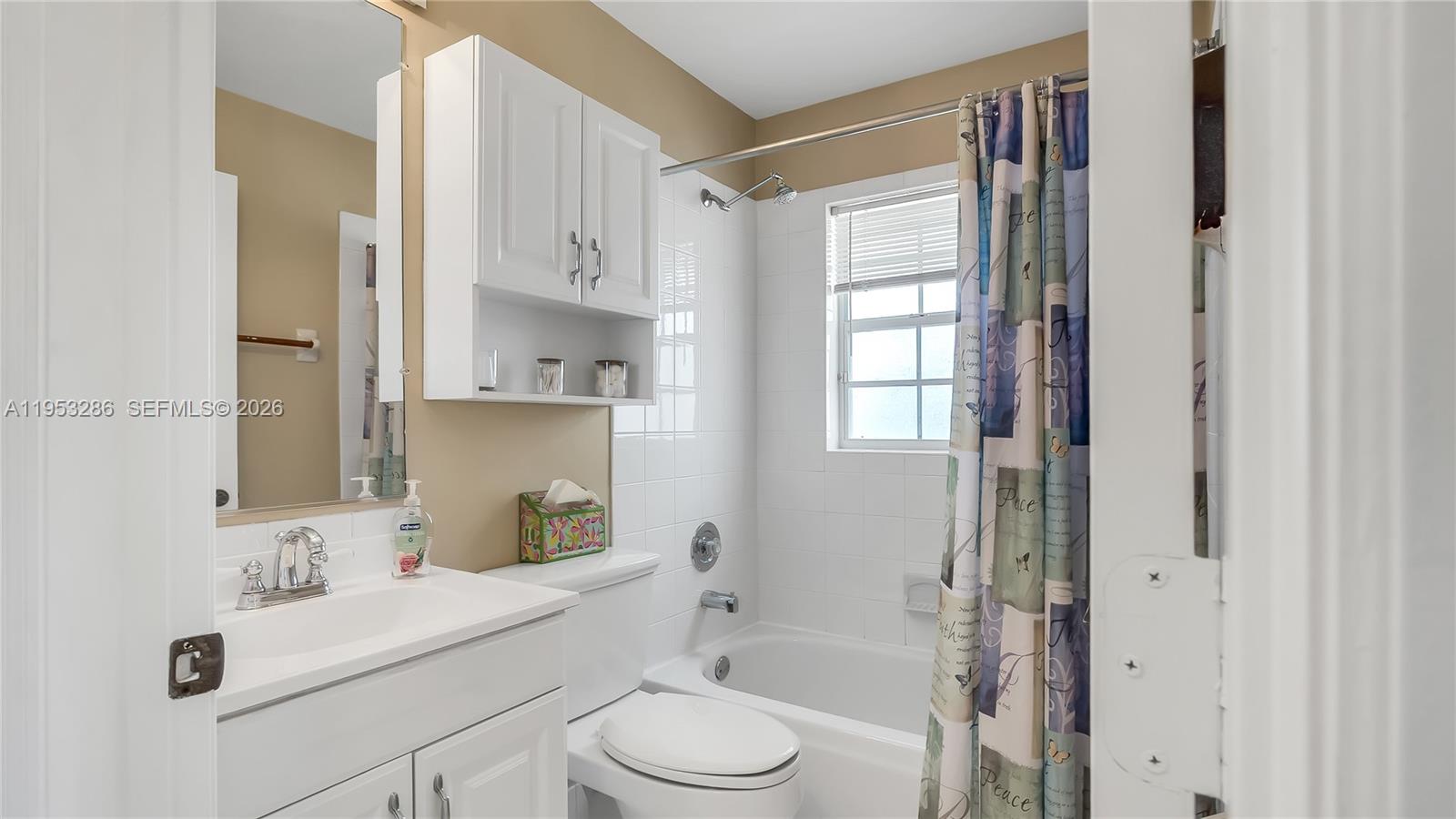 15486 Southwest 147th Street Miami, FL 33196 - Photo 23 of 30 a bathroom with a sink toilet vanity and shower