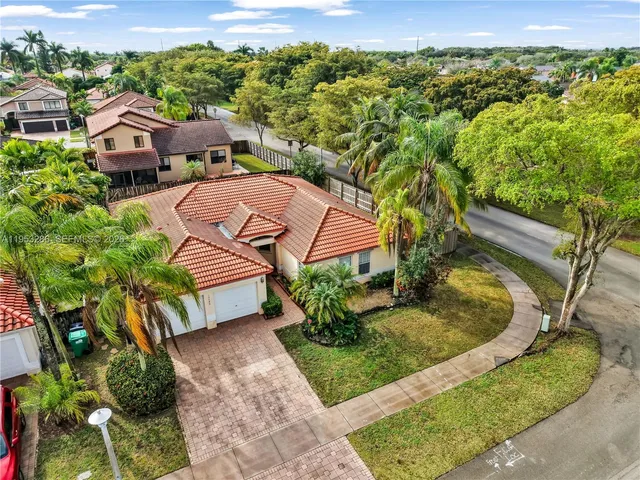an aerial view of a house with a garden