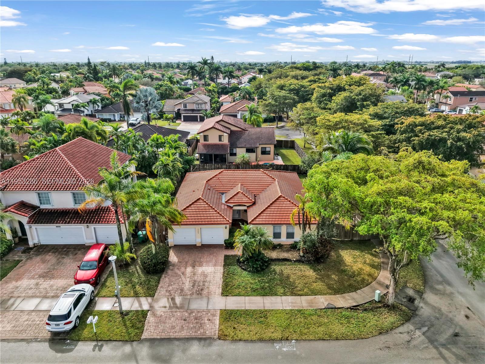 15486 Southwest 147th Street Miami, FL 33196 - Photo 28 of 30 an aerial view of a house with a garden