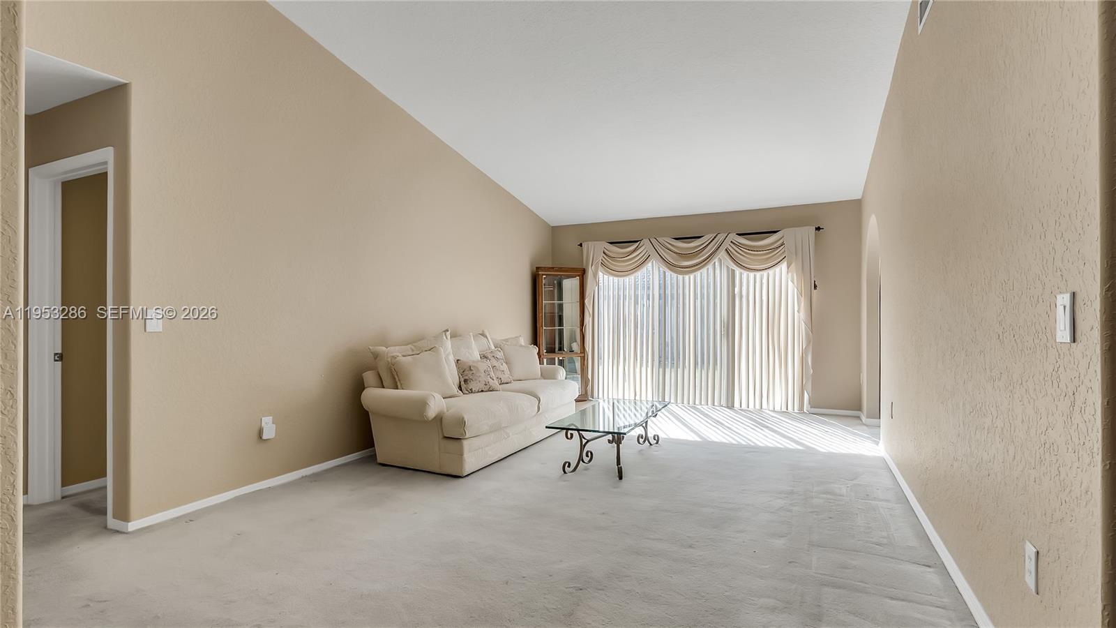 15486 Southwest 147th Street Miami, FL 33196 - Photo 4 of 30 a living room with furniture and a window