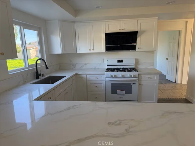 a kitchen with a stove and a microwave