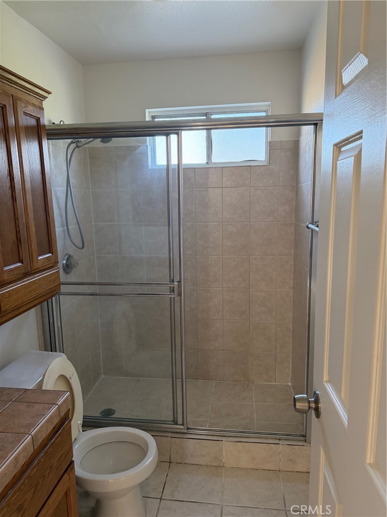 723 Ford Street Corona, CA 92879 - Photo 14 of 36 a bathroom with a shower a toilet and a sink