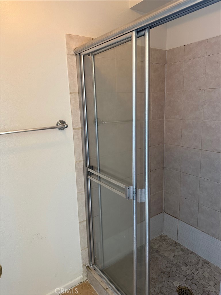 723 Ford Street Corona, CA 92879 - Photo 21 of 36 a bathroom with a glass shower door