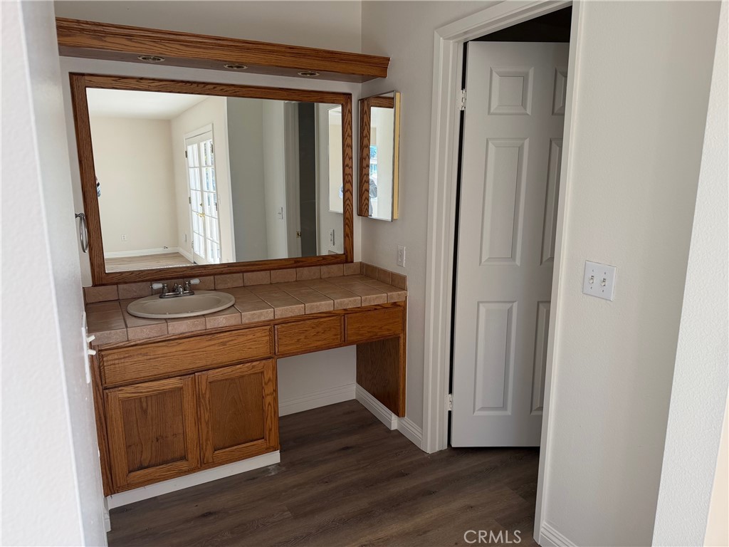 723 Ford Street Corona, CA 92879 - Photo 24 of 36 a bathroom with a sink and a mirror
